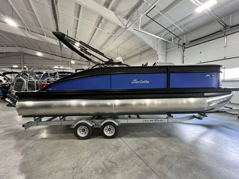 The Image of 2025 Barletta ARIA A22UC pontoon boat in showroom on trailer. - 0