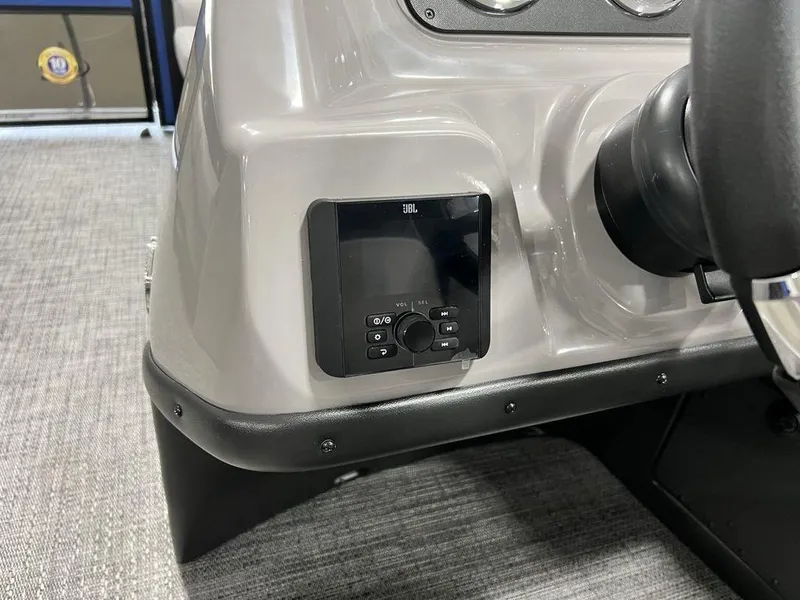 Slide: The Image of 2025 Barletta ARIA A22UC boat dashboard with JBL audio system. - 11