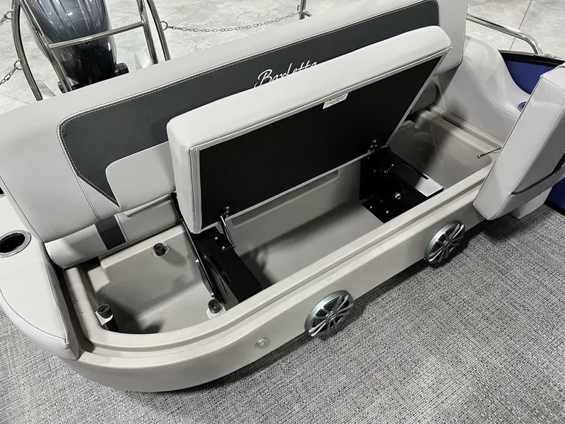 Slide: The Image of 2025 Barletta ARIA A22UC boat with open storage compartment and seating. - 12
