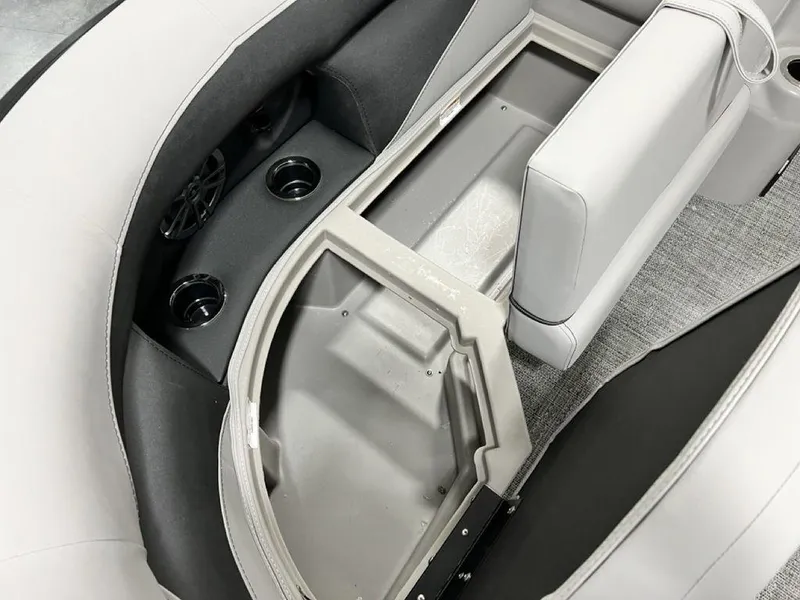 Slide: The Image of Interior storage compartment of 2025 Barletta ARIA A22UC boat with cup holders and seating. - 13