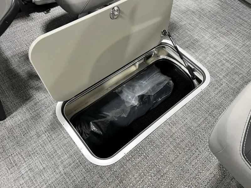 Slide: The Image of 2025 Barletta ARIA A22UC under-seat storage compartment with a black bag inside. - 15
