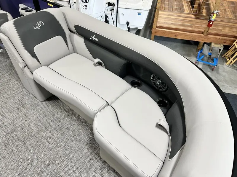 Slide: The Image of Barletta ARIA A22UC 2025 boat interior with luxurious seating and cup holders. - 16