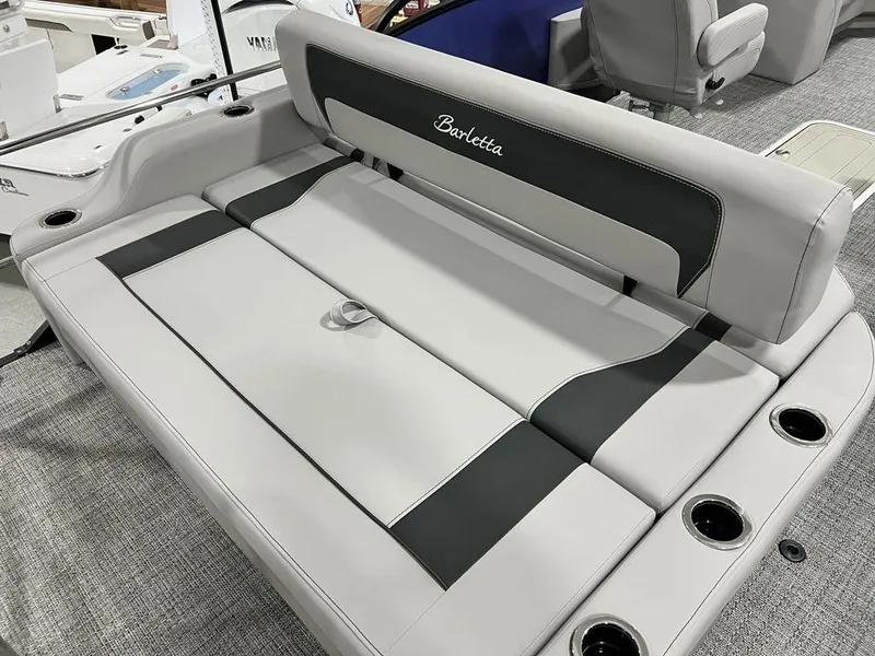 Slide: The Image of Barletta ARIA A22UC 2025 boat interior seating with cup holders and sleek design. - 17