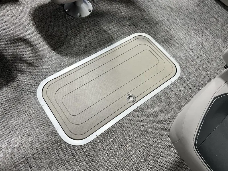 Slide: The Image of 2025 Barletta ARIA A22UC floor storage compartment with gray carpet. - 19