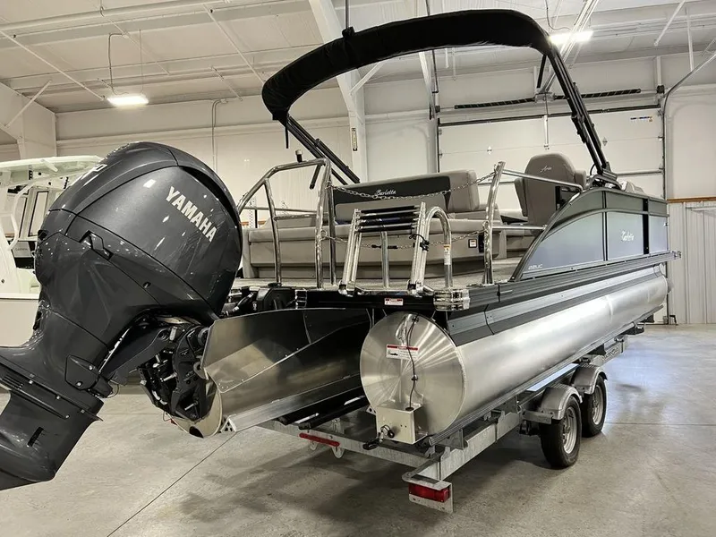 Slide: The Image of 2025 Barletta ARIA A22UC pontoon boat with Yamaha outboard motor in a showroom. - 23