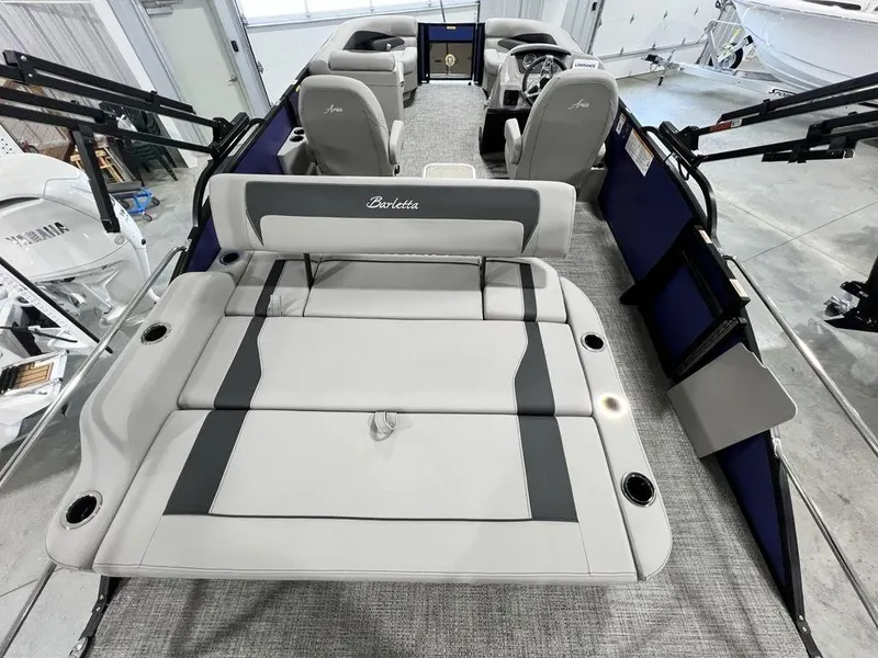 Slide: The Image of 2025 Barletta ARIA A22UC pontoon boat interior with luxurious seating and modern design. - 5