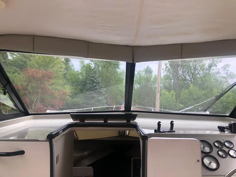 Slide: The Image of Interior view of 1997 Bayliner Ciera 2452 Express boat cockpit with dashboard and windows. - 15