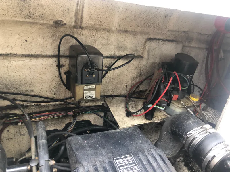 Slide: The Image of Engine compartment of a 1997 Bayliner Ciera 2452 Express with visible wiring and components. - 22