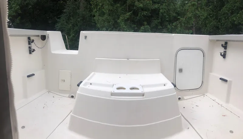 Slide: The Image of 1997 Bayliner Ciera 2452 Express boat deck with storage compartments and seating. - 18