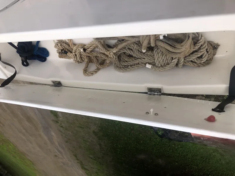 Slide: The Image of Rope storage compartment on a 1997 Bayliner Ciera 2452 Express boat. - 34
