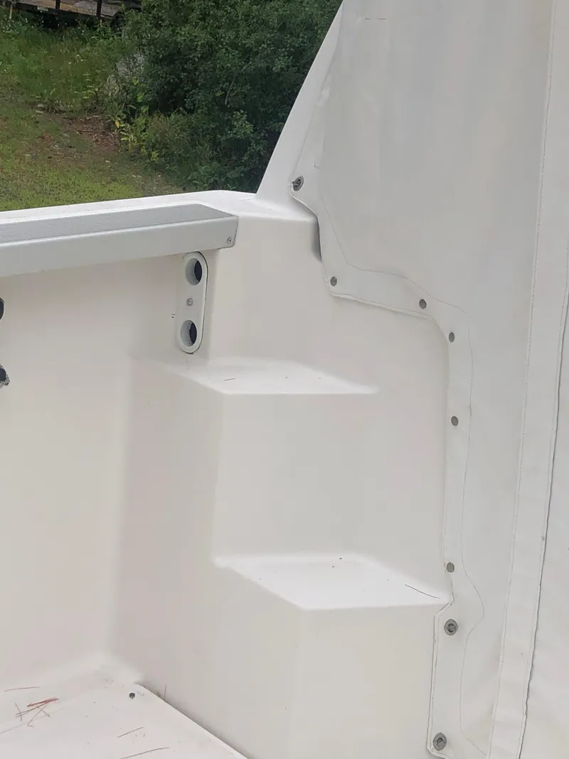 Slide: The Image of 1997 Bayliner Ciera 2452 Express boat interior with white steps and railing. - 35