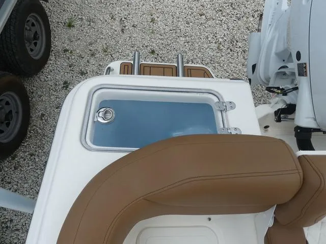 Slide: The Image of Close-up of the 2025 Pioneer Islander 222 boat's seating and storage area. - 11