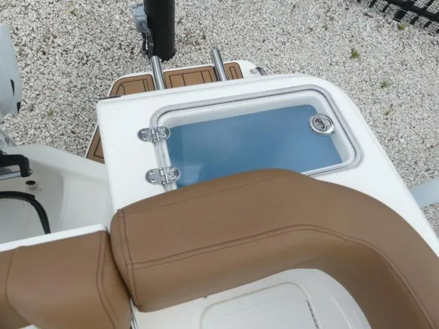 Slide: The Image of 2025 Pioneer Islander 222 boat console with steering wheel and controls. - 12