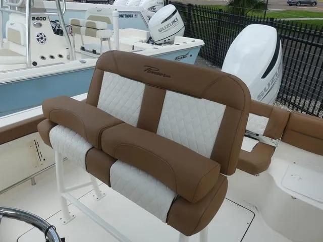 Slide: The Image of Control panel of a 2025 Pioneer Islander 222 boat with compass and switches. - 16