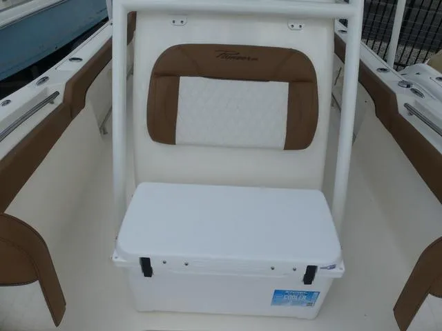 Slide: The Image of 2025 Pioneer Islander 222 boat with T-top and seating. - 22