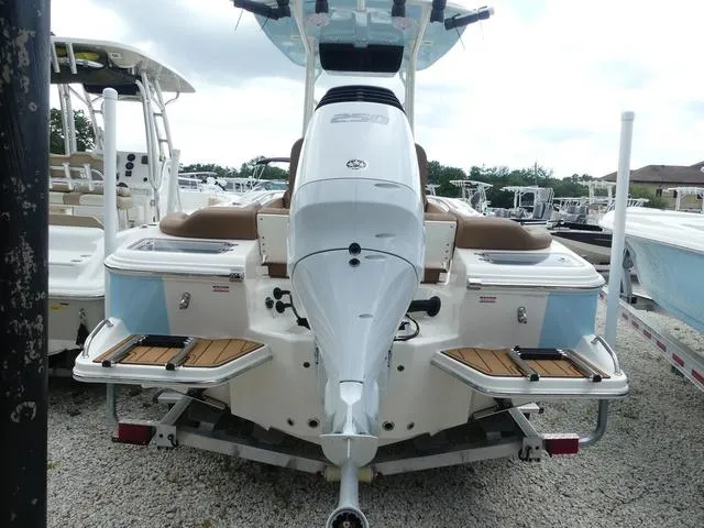 Slide: The Image of Pioneer Islander 222 boat 2025 model with Suzuki outboard motor and cushioned seating. - 9