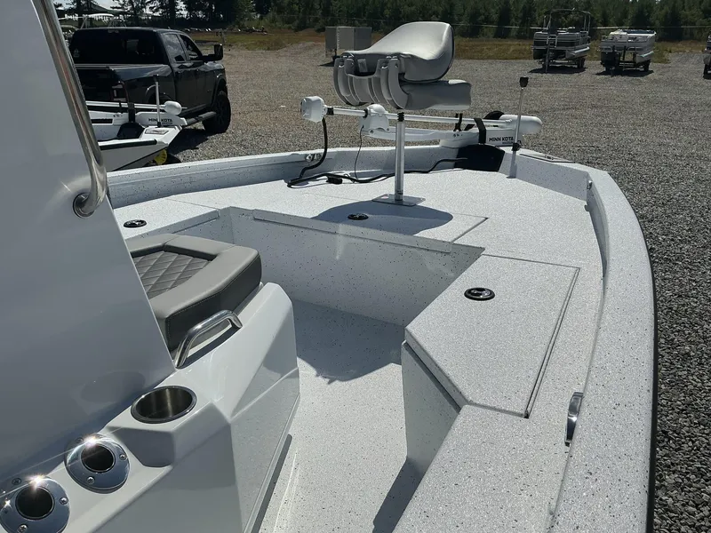 Slide: The Image of 2025 Xpress H20B NEW CONSOLE boat with seating and storage compartments. - 3