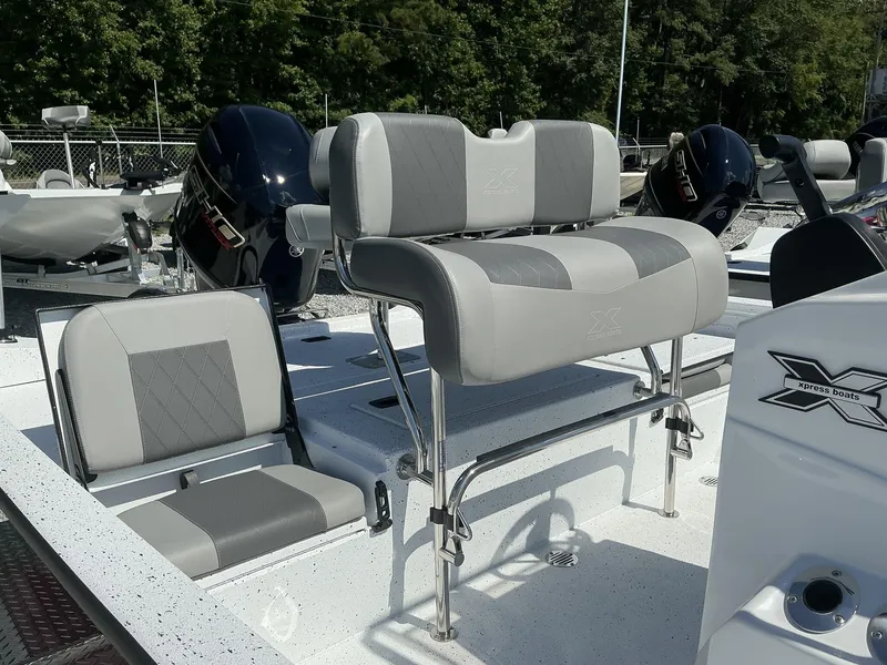 Slide: The Image of 2025 Xpress H20B NEW CONSOLE boat with dual seating and Yamaha outboard motor. - 6