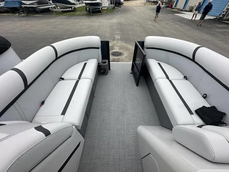 Slide: The Image of 2024 Crest Classic LX 220 SLC pontoon boat interior with spacious seating. - 3