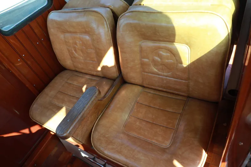 Slide: The Image of 1982 Shamrock Pilothouse leather seats with wooden armrest. - 13