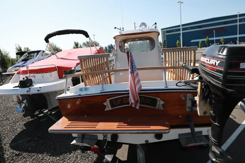 Slide: The Image of 1982 Shamrock Pilothouse boat Li'l General with Mercury outboard motor. - 4