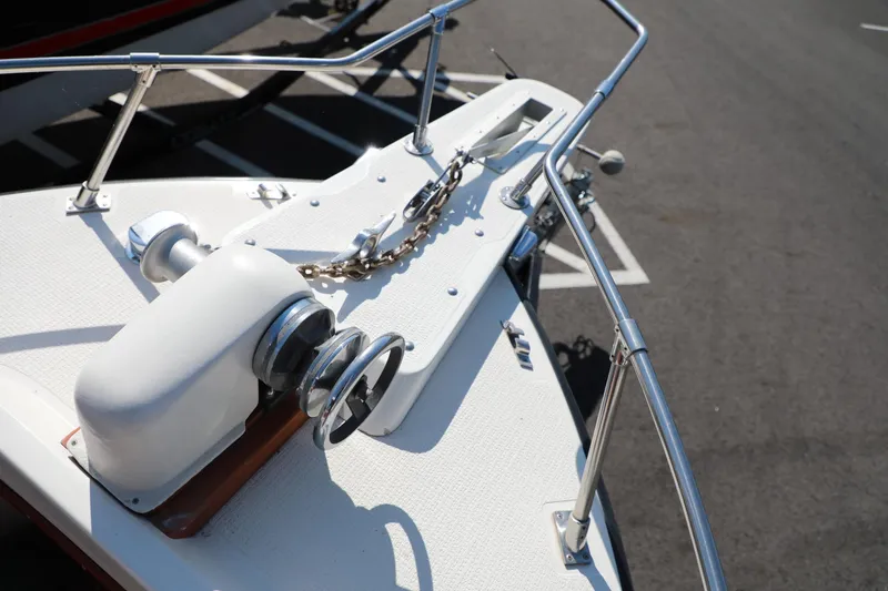 Slide: The Image of 1982 Shamrock Pilothouse boat bow with anchor chain and winch. - 8