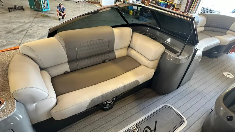 Slide: The Image of 2023 Avalon Excalibur Elite Windshield boat interior with luxurious seating. - 12