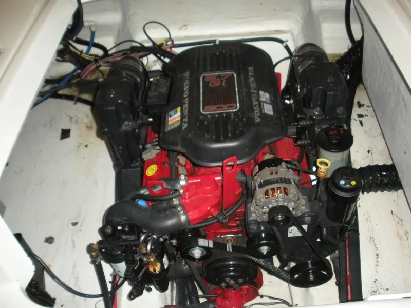 Slide: The Image of 2009 Larson LXi 258 boat engine compartment with Volvo Penta engine. - 14