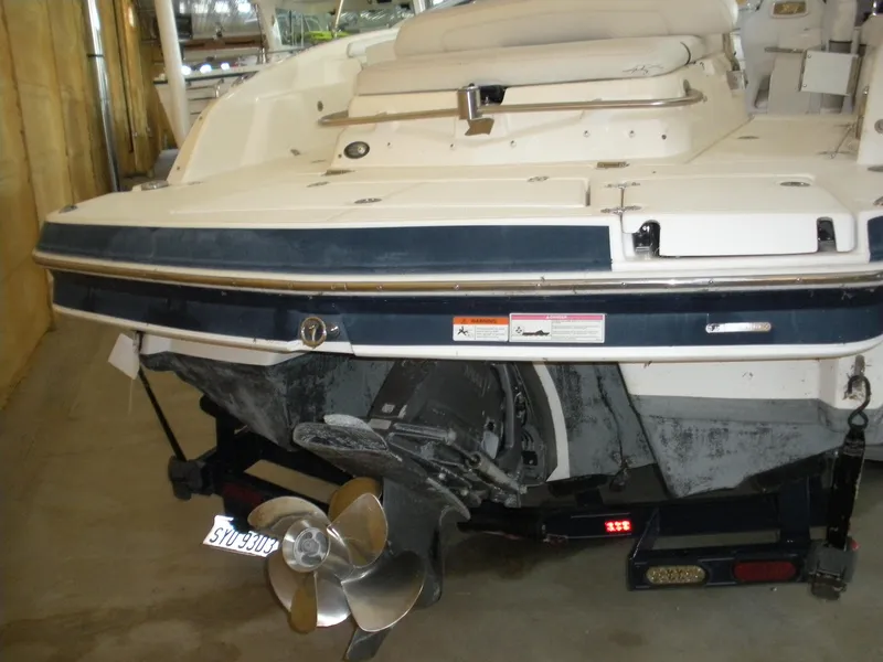 Slide: The Image of 2009 Larson LXi 258 boat stern with propeller and trailer. - 4