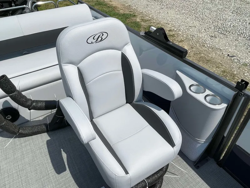 Slide: The Image of 2025 Bentley Pontoons Legacy 220 Swingback captain's chair with armrests and cup holders. - 12