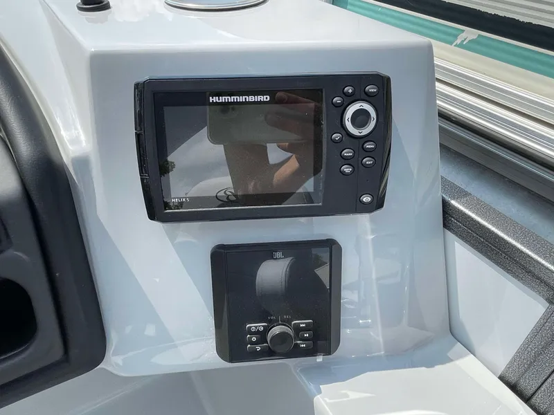 Slide: The Image of Control panel of 2025 Bentley Pontoons Legacy 220 Swingback with Humminbird electronics. - 18