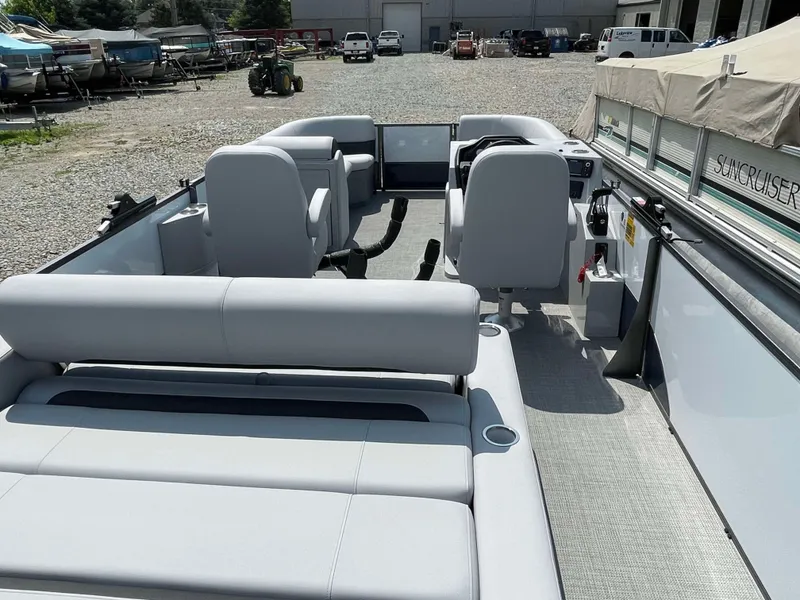 Slide: The Image of 2025 Bentley Pontoons Legacy 220 Swingback interior with modern seating and control console. - 23