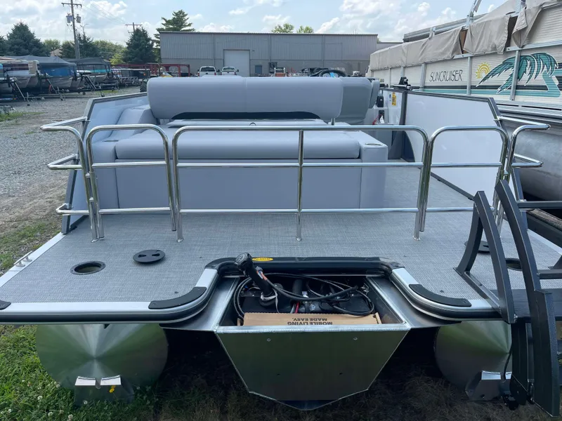 Slide: The Image of 2025 Bentley Pontoons Legacy 220 Swingback, rear view, showcasing seating and deck layout. - 5