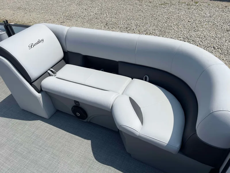 Slide: The Image of 2025 Bentley Pontoons Legacy 220 Swingback interior seating in light gray upholstery. - 9