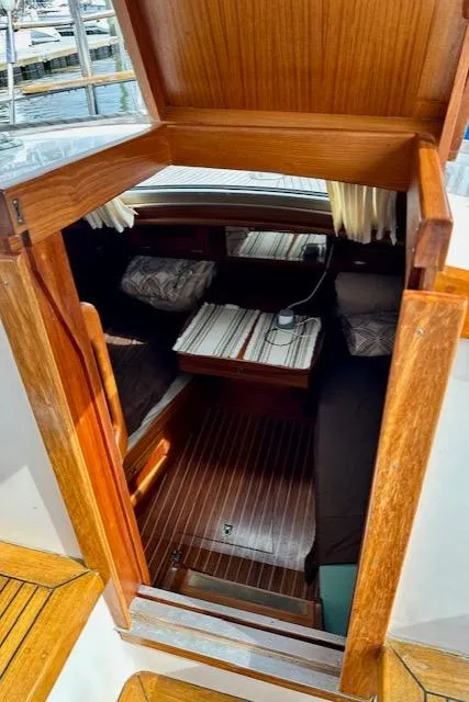 Slide: The Image of Cozy cabin interior of 2002 Vilm 116 yacht with wooden finish. - 10