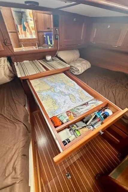 Slide: The Image of Cozy Vilm 116 yacht cabin with navigation table and storage, 2002 model. - 12