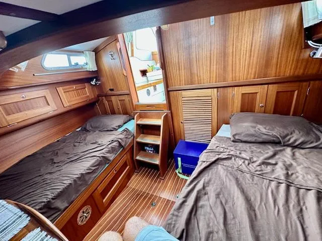 Slide: The Image of Cozy wooden cabin interior of 2002 Vilm 116 yacht with twin beds. - 13