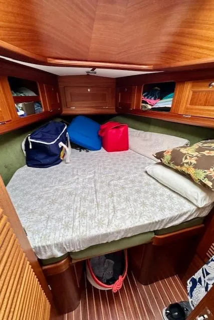 Slide: The Image of Cozy cabin interior of 2002 Vilm 116 yacht with wooden finish and storage. - 15