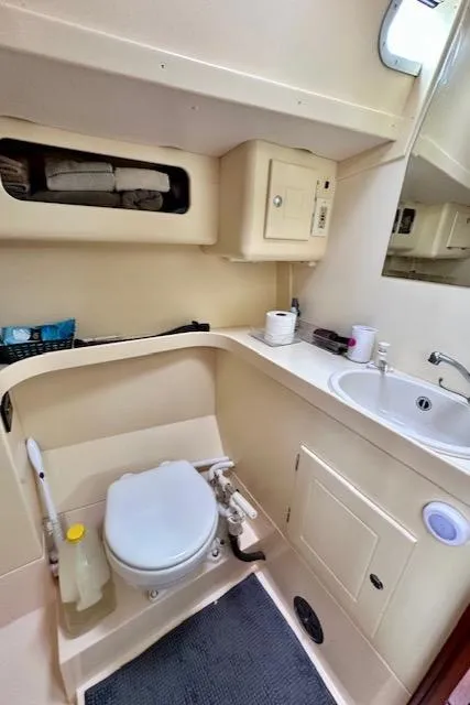 Slide: The Image of Compact Vilm 116 yacht bathroom with toilet, sink, and storage, 2002 model. - 24