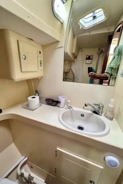 Slide: The Image of Compact bathroom in 2002 Vilm 116 yacht with sink, mirror, and storage. - 25