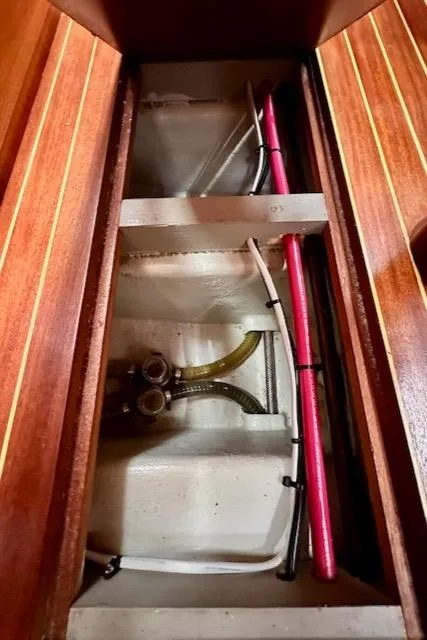 Slide: The Image of Vilm 116 yacht interior plumbing system, 2002 model, with wooden paneling. - 33