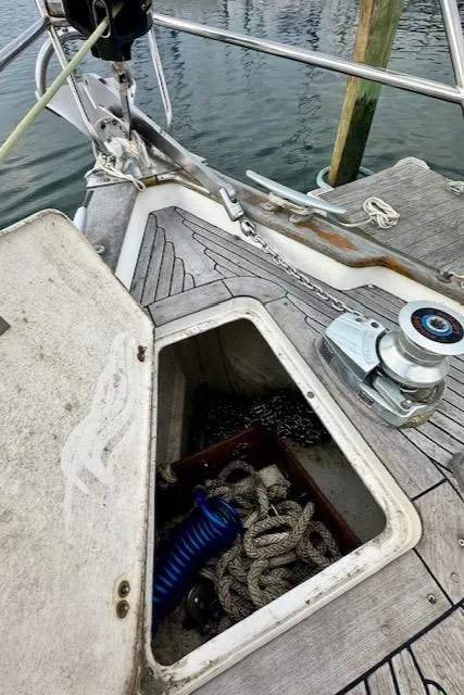 Slide: The Image of Open anchor locker on 2002 Vilm 116 sailboat with ropes and winch. - 39