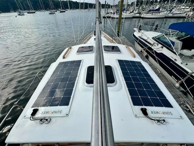 Slide: The Image of Sailboat with solar panels on deck, Vilm 116 model, 2002, docked in a marina. - 5