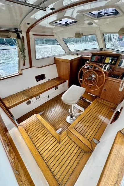 Slide: The Image of Interior of 2002 Vilm 116 boat with wooden helm and seating. - 6