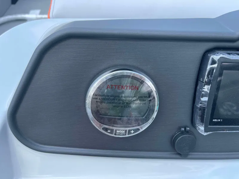 Slide: The Image of Close-up of 2025 Bentley Pontoons Bolt dashboard with attention warning. - 11