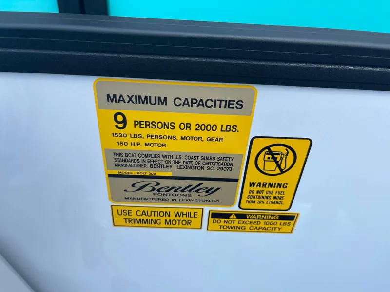 Slide: The Image of 2025 Bentley Pontoons Bolt capacity label: 9 persons or 2000 lbs, 150 HP motor. - 15