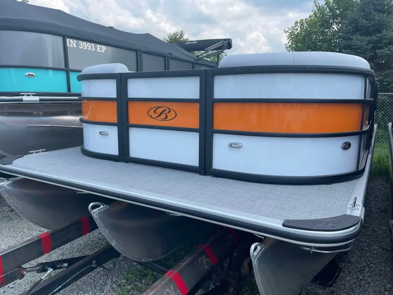 Slide: The Image of 2025 Bentley Pontoons Bolt pontoon boat with orange and white exterior. - 2