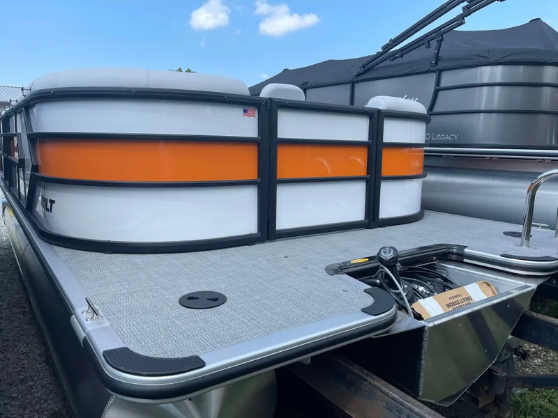 Slide: The Image of 2025 Bentley Pontoons Bolt pontoon boat with orange and white exterior. - 3