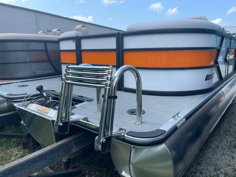 Slide: The Image of 2025 Bentley Pontoons Bolt boat with ladder, docked outdoors. - 4