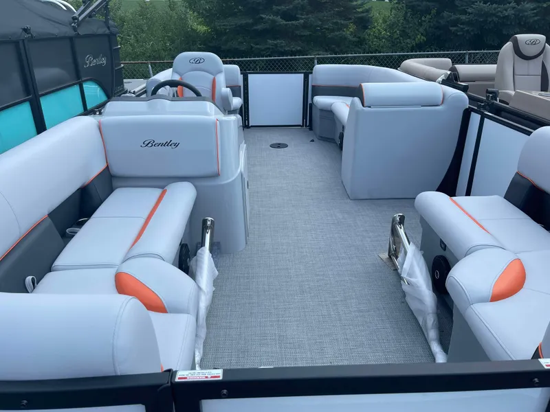 Slide: The Image of 2025 Bentley Pontoons Bolt interior with spacious seating and modern design. - 5